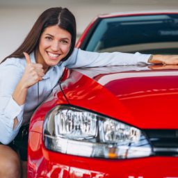 young-woman-buying-car_1303-13628