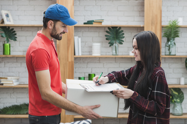 pretty-woman-signing-receiving-parcel_23-2147801290