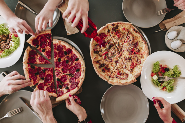 people-eating-pizza-restaurant_23-2148172682