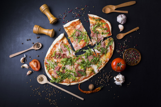 slices-italian-pizza-with-utensils-ingredients-black-kitchen-worktop_23-2148076119