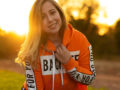 woman-in-orange-and-white-hoodie-smiling-3641193