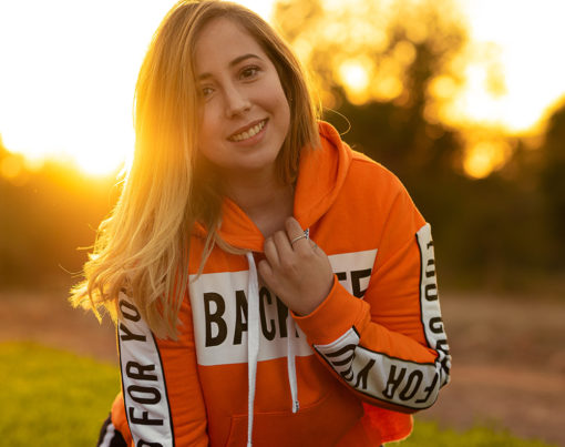 woman-in-orange-and-white-hoodie-smiling-3641193