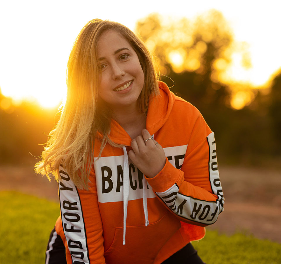 woman-in-orange-and-white-hoodie-smiling-3641193
