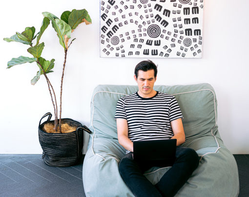 man-sitting-cozy-while-working-on-his-laptop-3153203