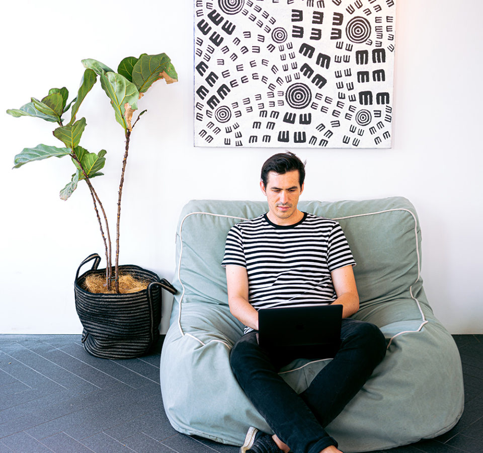 man-sitting-cozy-while-working-on-his-laptop-3153203
